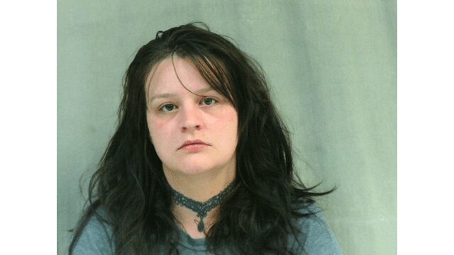 A mother faces charges after a three-year-old child was found outside naked, holding a knife and fireworks.