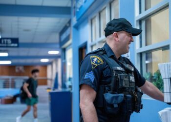 UPD officer Cody Smith interacts with members of the WVU campus community, April 5, 2023. Photo: Morgan Goff.
