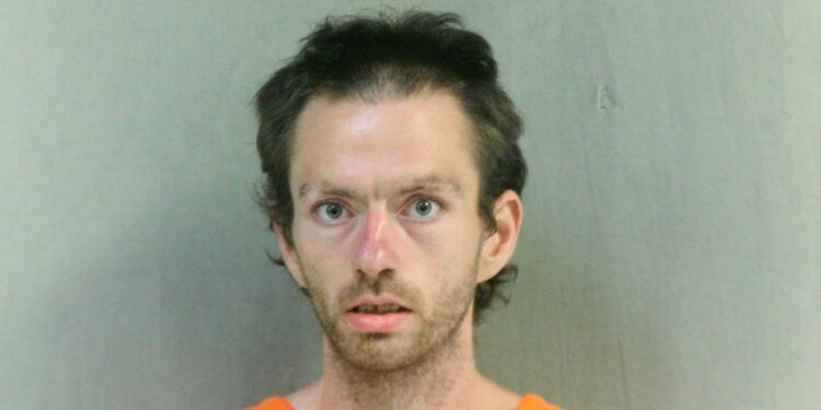 Man arrested after striking another man with a flashlight