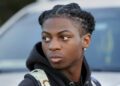 Darryl George, a 17-year-old junior, before walking across the street to go into Barbers Hill High School after serving a 5-day in-school suspension for not cutting his hair Monday, Sept. 18, 2023, in Mont Belvieu. (AP Photo/Michael Wyke)
