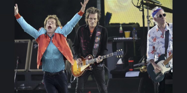 Mick Jagger, left, Ronnie Wood, center, and Keith Richards, right, of the band “The Rolling Stones,” perform onstage during the last concert of their “Sixty” European tour in Berlin, Germany, Aug. 3, 2022. On Monday, Sept. 4, 2023, the Rolling Stones announced they will release their first album of original material in 18 years. Titled “Hackney Diamonds,” the legendary rock band will reveal the full details on Wednesday, Sept. 6, at an event in Hackney in East London. (AP Photo/Michael Sohn, File)