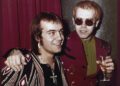 British pop idol Elton John appears with his lyricist Bernie Taupin in London on March 5, 1973. Taupin's memoir, "Scattershot: Life, Music, Elton, and Me" releases this week. (AP Photo/John Glanvill, File)