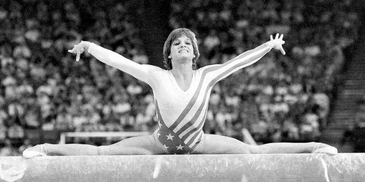 FILE - Mary Lou Retton, of the United States, performs on the balance beam during the women's gymnastics individual all-around finals at the Summer Olympics on Aug. 3, 1984, in Los Angeles. Retton. 55, is in intensive care in a Texas hospital fighting a rare form of pneumonia, according to her daughter McKenna Kelley. (AP Photo/Suzanne Vlamis, File)