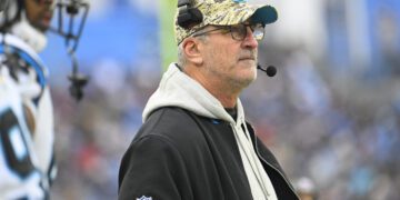 Carolina Panthers head coach Frank Reich watches from the sideline during the first half of an NFL football game against the Tennessee Titans Sunday, Nov. 26, 2023, in Nashville, Tenn. (AP Photo/John Amis)