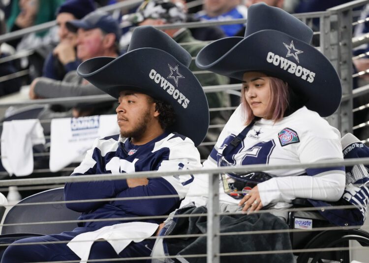Dallas Cowboys supporters look on during the second half of an NFL football game against the Green Bay Packers, Sunday, Jan. 14, 2024, in Arlington, Texas. (AP Photo/Sam Hodde)