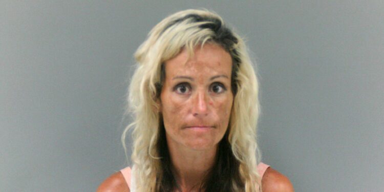 Woman arrested after striking man with truck, breaking his leg, in a domestic incident in Chapmanville, WV.