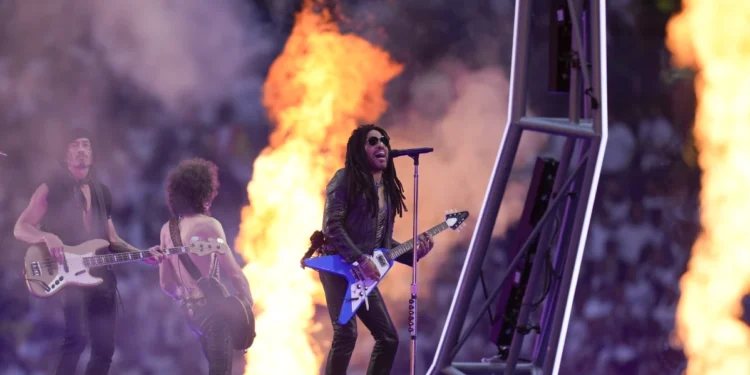 Lenny Kravitz performs prior to the Champions League final 2 soccer match between Borussia Dortmund and Real Madrid at SC Wembley stadium in London, Saturday, June 1, 2024. (AP Photo/Kin Cheung)