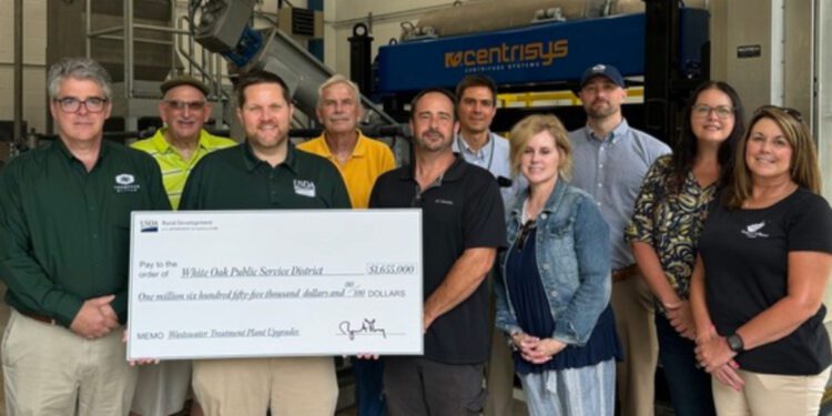 USDA Rural Development West Virginia State Director Ryan Thorn presented a check to White Oak PSD staff and other local stakeholders.