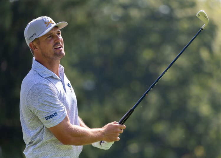 Captain Bryson DeChambeau of Crushers GC watches his shot during the pro-am before the start of LIV Golf Greenbrier at The Old White at The Greenbrier on Thursday, August 15, 2024 in White Sulphur Springs, West Virginia. (Photo by Jon Ferrey/LIV Golf)