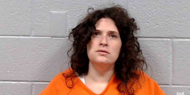 Woman throws herself against the outside wall of a trailer