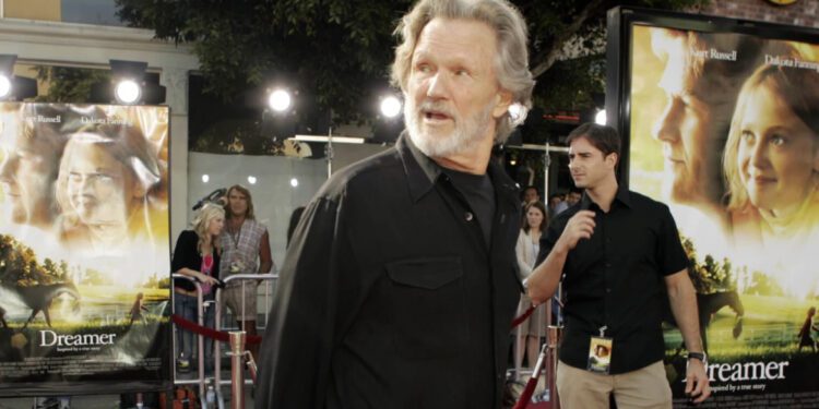 Actor Kris Kristofferson walks down the red carpet during the premiere for his new movie "Dreamer," Oct. 9, 2005, in the Westwood section of Los Angeles. (AP Photo/Ric Francis, File)