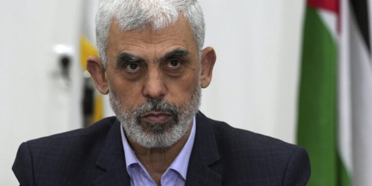 FILE - Yahya Sinwar, head of Hamas in Gaza, chairs a meeting with leaders of Palestinian factions at his office in Gaza City, on April 13, 2022. (AP Photo/Adel Hana, File)
