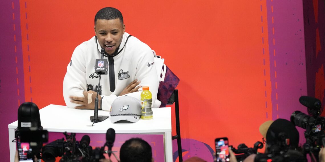Philadelphia Eagles running back Saquon Barkley participates during Super Bowl 59 Opening Night, Monday, Feb. 3, 2025, in New Orleans, ahead of the NFL football game between the Philadelphia Eagles and the Kansas City Chiefs Sunday. (AP Photo/Godofredo A. Vásquez)