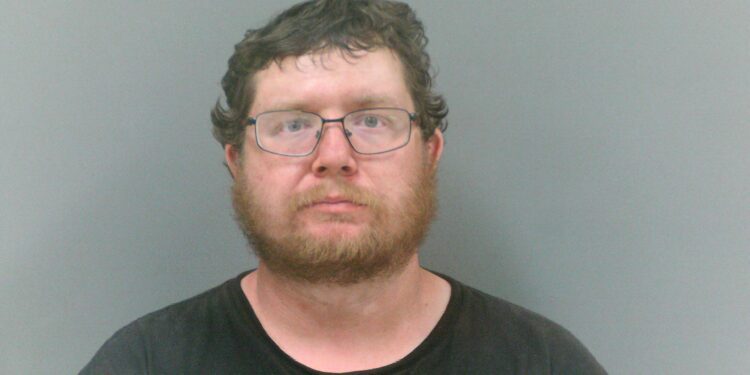 Man Charged After Allegedly Pointing Rifle at Woman and Child