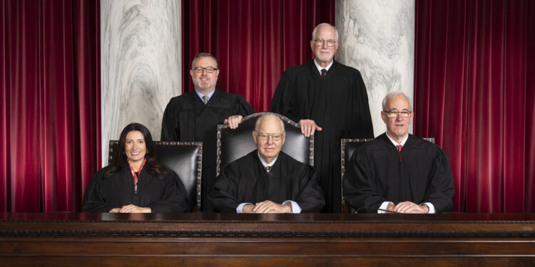 Official portrait of the 2025 Supreme Court of Appeals of West Virginia with Chief Justice Bill Wooton, Justice Haley Bunn, Justice Charles Trump, Justice Thomas Ewing and Senior Status Justice John Hutchison.  October 23, 2025.  (J. Alex Wilson - Supreme Court of Appeals of West Virginia)